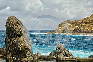 Rocks and cyan sea