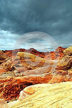 Rocks in desert with stormy sky