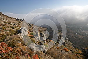 Rocks, fog in autumn Crimea mountains. Landscape.