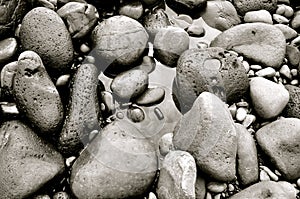 Rocks forming Black Sand Beach on Maui, Hawaii photo