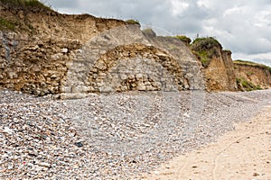 Rocks and gravel on Omaha Beach Normandy France