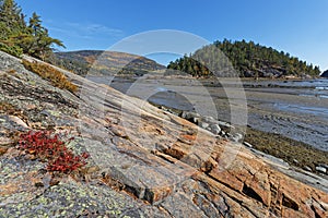 Rocks and hill in Anse-Aux-Rochers at low tide