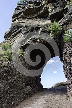 rocks with hole with blue sky view