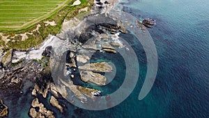 Rocks on the Irish littoral, top view. The shore of the Atlantic Ocean. kind of Northern Europe. Rocky coastline. Aerial photo.