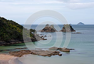 Rocks and islands near a beach in New Zealand