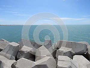 rocks of the jetty in the sea.