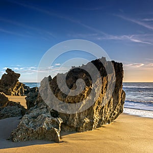 Rocks in La Barrosa beach in Cadiz photo