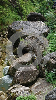 rocks, limestone boulders over a mountain stream, stream.