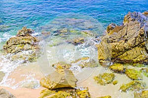 Rocks of the Mediterranean Sea in cloudy weather in Lloret de Mar, Costa Brava