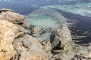 Rocks by the Mediterranean sea on the island of Ibiza in Spain,