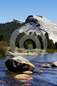 Rocks In Merced River Yosemite National Park With Blue Sky