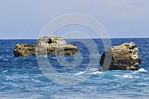 Rocks in the middel of ocean photo