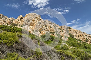 Rocks and mountains behing Bay of Cala Coticcio in Caprera island, Sardinia, Italy