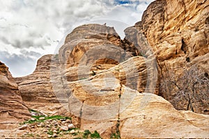 Rocks in mountains of Petra on cloudy day