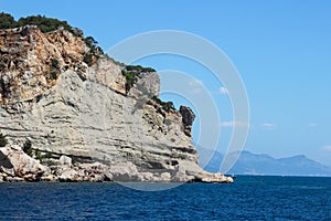 Rocks near the coast of the Mediterranean sea on a background of mountains in Turkey