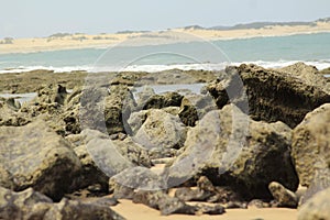 Ocean and seashore near the rocks photo