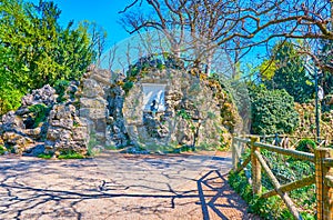 The rocks in Park of Montanelli with commemorative plaque to Emilio de Marchi, famous Italian novelist, Milan, Italy photo