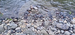 rocks and pebbles on the banks of the Batang Sangir South Solok river photo