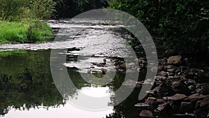 Rocks and pebbles by river side water