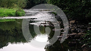 Rocks and pebbles by river side water