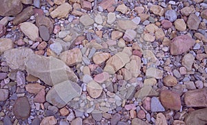 Rocks and pebbles on the riverbank.