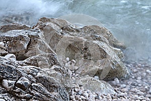 Rocks and pebles in sea mist