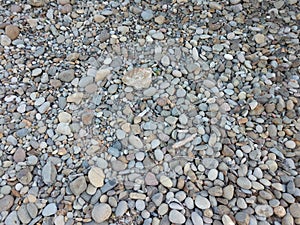 Rocks in a pile, naturally rounded by wind.