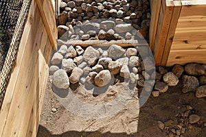 Rocks Placed at Bottom of a Raised Bed Garden