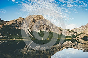 Rocks reflecting in lake