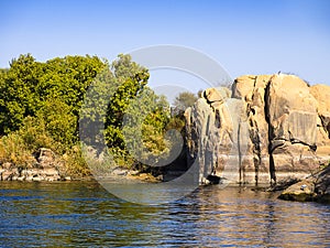 Rocks on the River Nile at Aswan in Egypt that mark limit of cruises