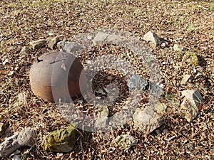 Rocks and rusty iron cauldron in a circle