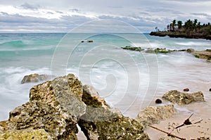 Rocks and sand along coast photo