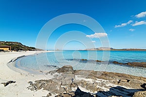 Rocks and sand in La Pelosa