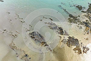 Rocks In The Sand At Low Tide