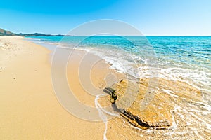 Rocks and sand in Piscina Rei beach photo