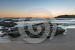 Rocks on the sand in the Rias Baixas, Galicia photo