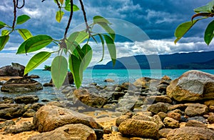 Rocks in the sand and sea at Juliao Beach, aka Praia do Juliao, in Ilhabela, Sao Paulo - Brazil,