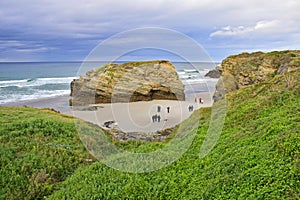 rocks on a sandy beach. Praia de Augas Santas, Ribadeo photo