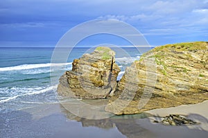 rocks on a sandy beach. Praia de Augas Santas, Ribadeo photo