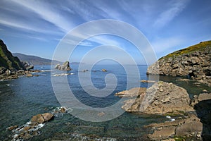 Rocks in sea near the island Gaztelugatxe photo
