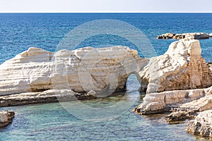 Rocks in the sea off the coast of Cyprus photo