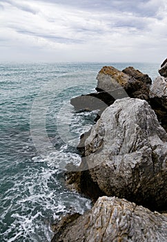 Rocks and sea shot on cloudy day