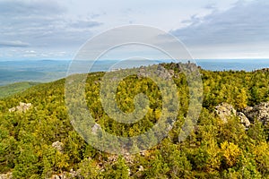 Rocks and Shad Tchup Ling Buddhist monastery on mountain Kachkanar. The Urals. Russia