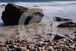 Rocks on the shore covered with a thin layer of mist. Hallett Cove, South Australia.