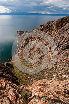 Rocks on the shore of Lake Baikal, vertical frame.