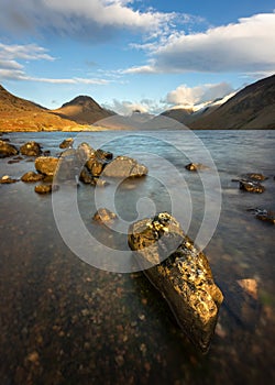 Rocks on shoreline of Britains Favourite View; Wastwater on a beautiful sunny Winter afternoon. Lake District, UK.