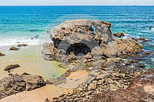 Rocks and small natural pools in an idyllic setting on Samoqueira beach, Porto CÃÂ´vo - Sines PORTUGAL photo