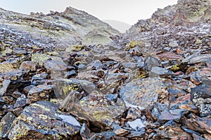 Rocks and snow at the slopes of Coma Pedrosa, highest mountain in Andor