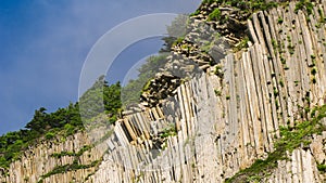 Rocks of Stolbchatiy cape in Kunashir, Kuril islands Russia