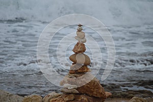 Rocks or stone balancing tower with sea as background